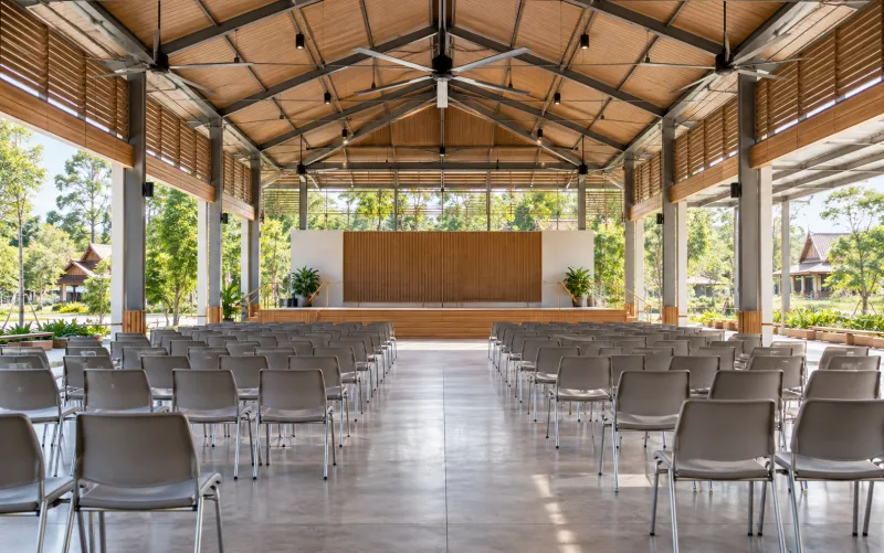 Open-sided community assembly hall — illustrative setting